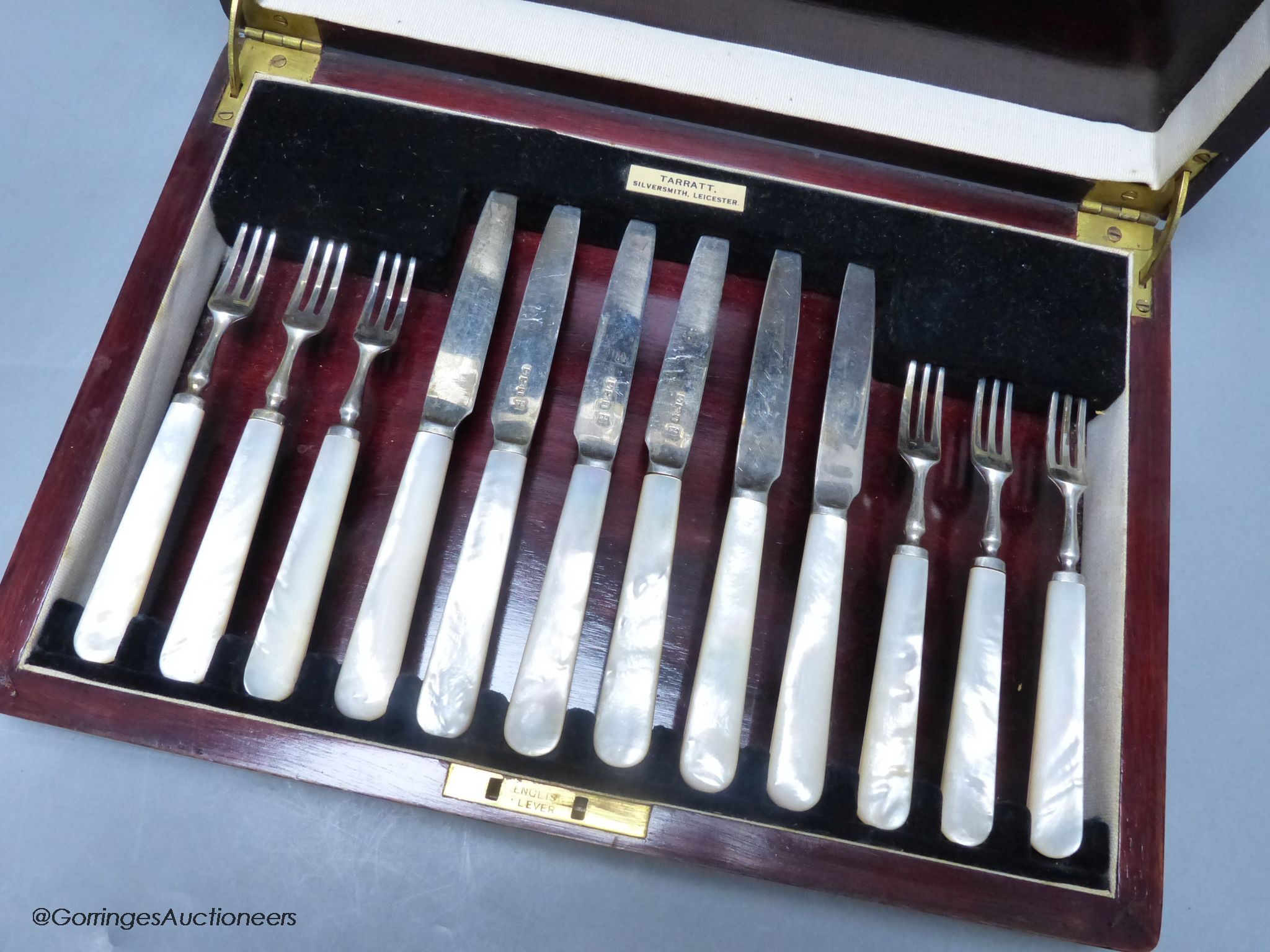 A George V cased set of six pairs of mother of pearl handled silver dessert eaters, Sheffield, 1933.